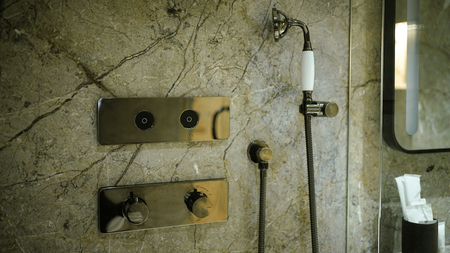 Infiniti Hotel, Indore | A washroom with a showerhead.