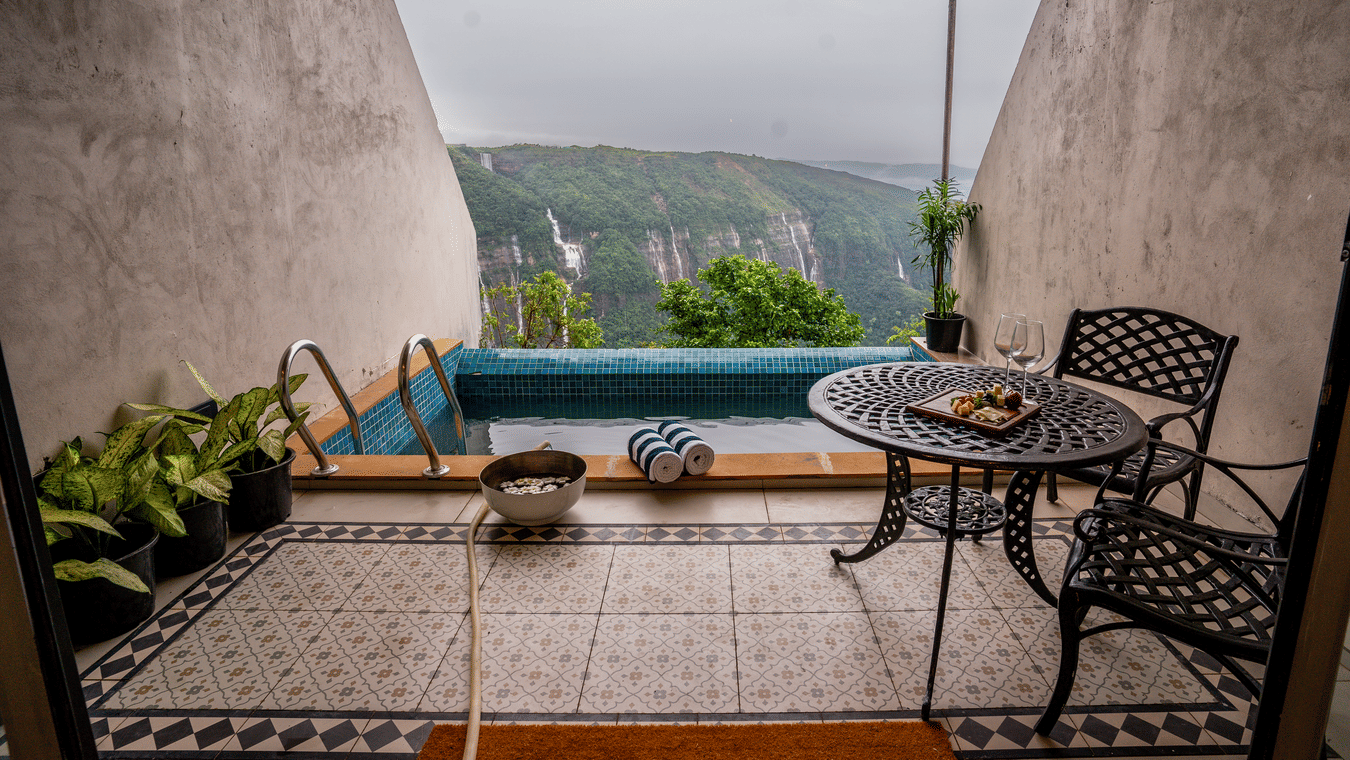 An outdoor space featuring an infinity pool - Polo Cherrapunjee Resort