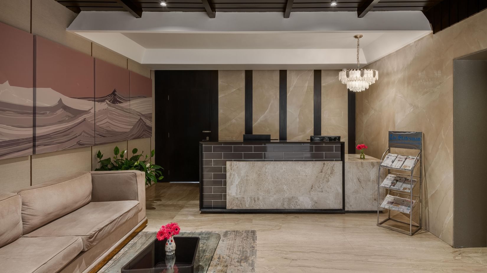 Reception desk and lobby at Voyage Milestone Hotel and Banquet.
