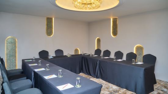 Conference room with U-shaped seating at Voyage Milestone Hotel and Banquet.