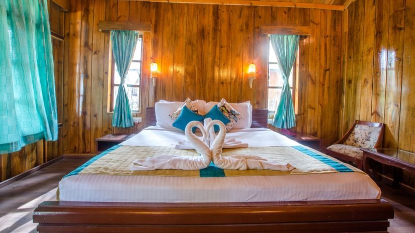 A king size bed bed with swan shaped towels