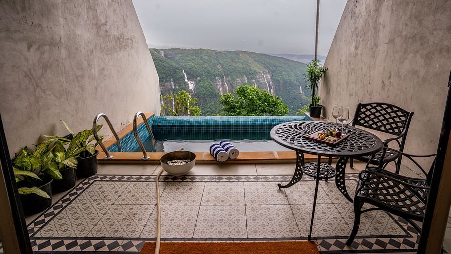 An image of a pool and next to it towel , bucket is kept, and a table is placed - Polo Orchid Resort, Cherrapunjee