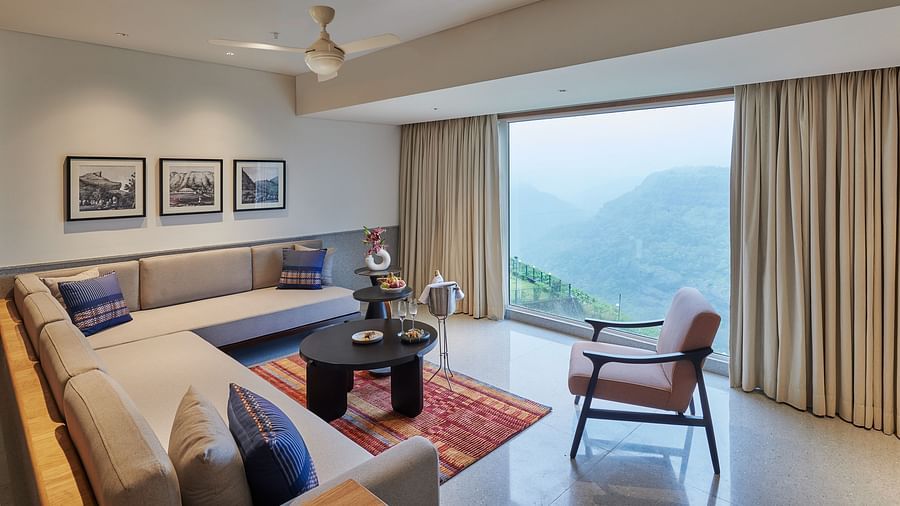 Image of a sitting area with a large window overlooking the valley at The Dukes Retreat.