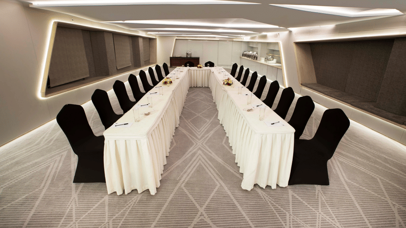 Contemporary boardroom setup with conference seating and presentation facilities for corporate meetings and workshops | Hablis Hotel Chennai