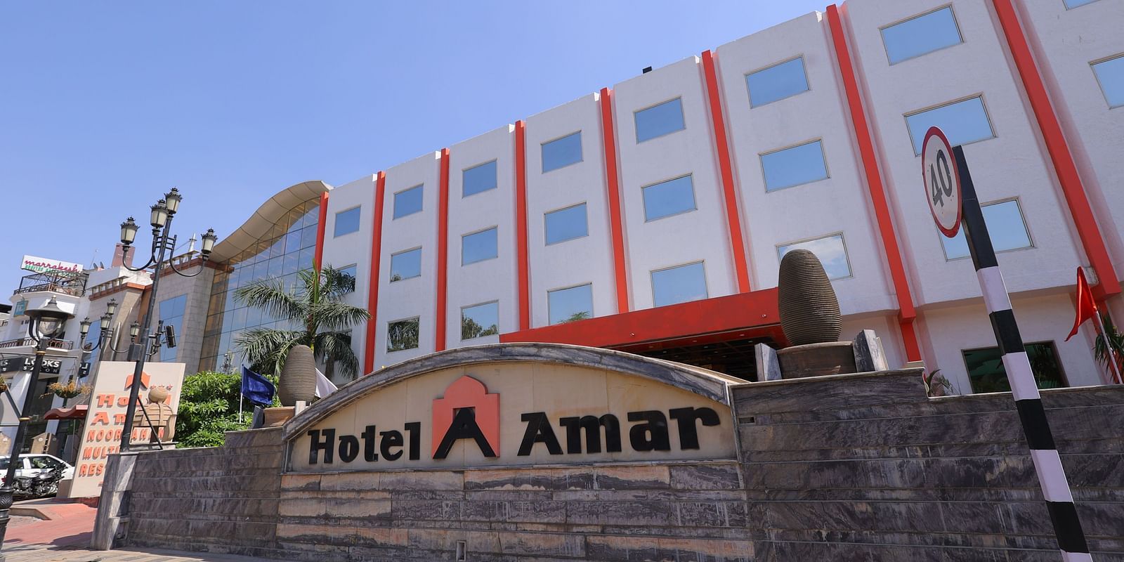 Overview image of the facade of Hotel Amar with the name written on a board