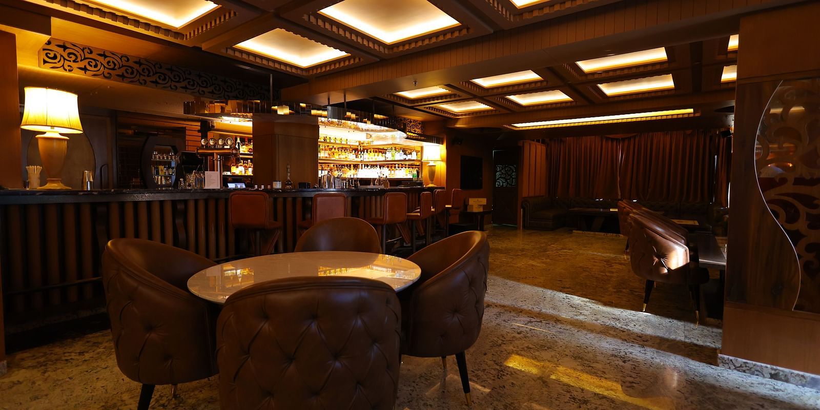 Image of seating arrangement of JBs lounge with chairs and tables