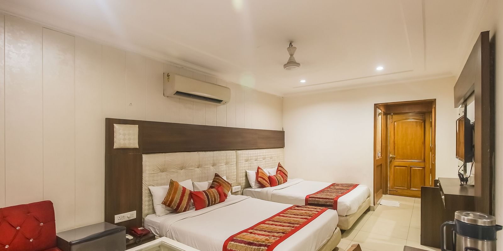 Family Room with two queen size beds, TV, work desk and a seating area - Hotel Diamond Plaza, Chandigarh.