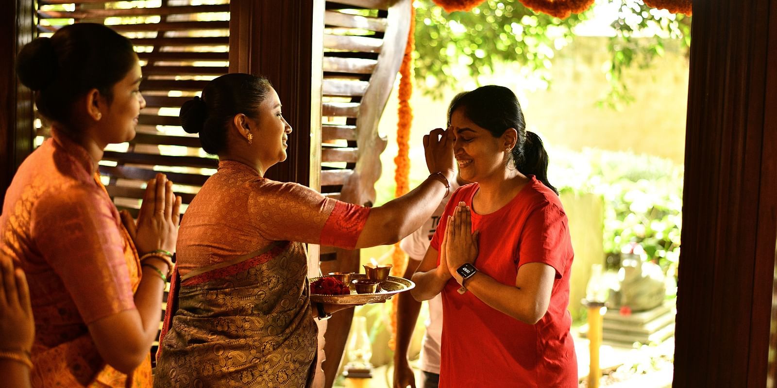 staff welcoming the guests at hoysala village resort, hassan