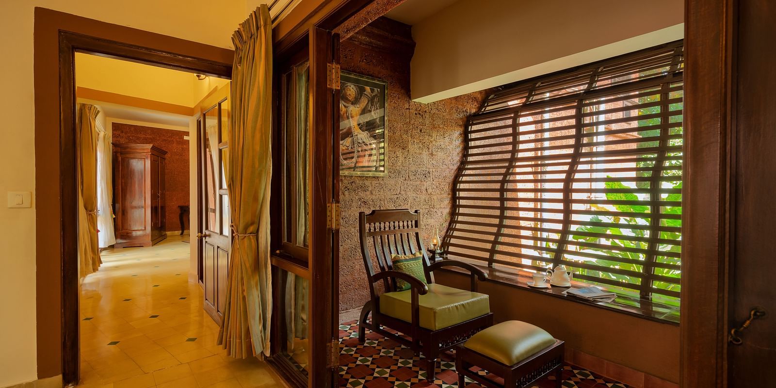 corner view of the sit out area besides the corridor at the luxury Jacuzzi villa at hoysala village resort, hassan