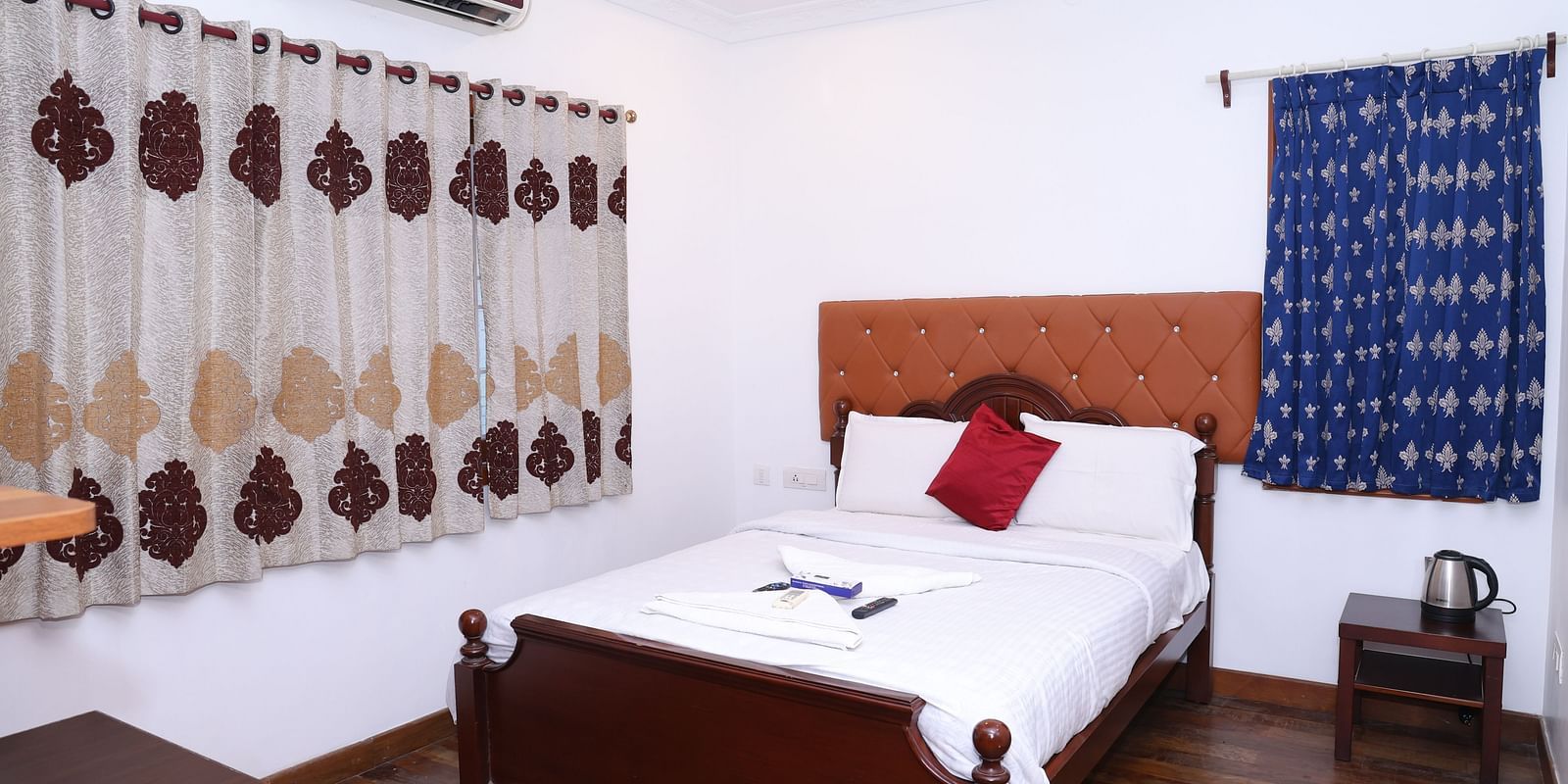 Image of a room with a bed and a window on the side at Villa Serenity Le Sejour, Pondicherry.