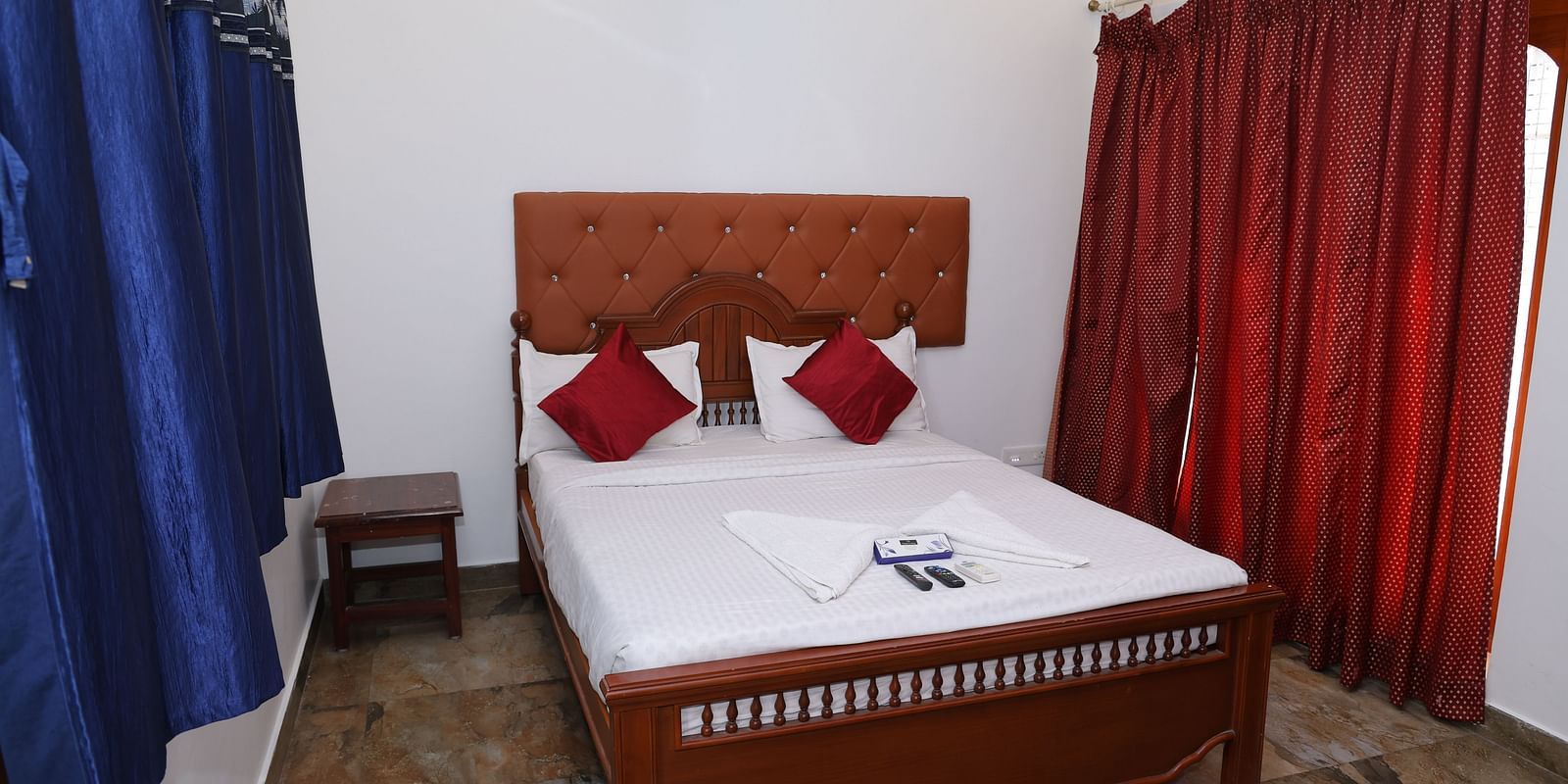 Image of a room with a bed a window on the side at Villa Serenity Le Sejour, Pondicherry.