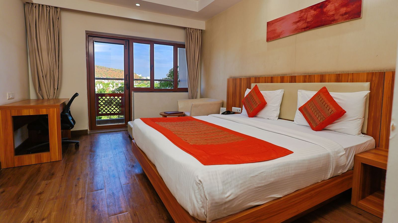 Golden Premium with Balcony and a pluhsy bed
