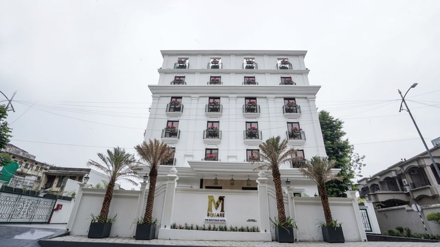 Front view of M2 Square by Monday Premium featuring a 5-storey building with a white exterior.