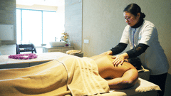 A person receiving a massage, highlighting the spa's focus on relaxation and wellness - Karma Lakelands.