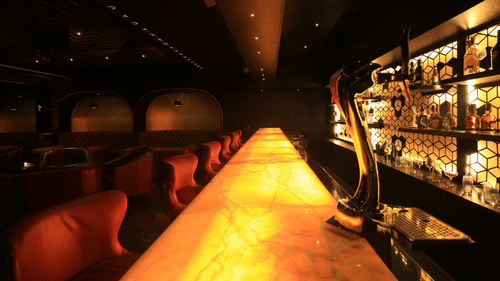 a close up shot of the bar counter at Alchemy, our in-house bar in Chennai - Raj Park Hotel, Chennai