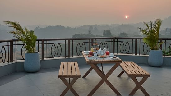 Sunrise breakfast at Sky Deck with panoramic views and seating arrangements at The Dukes Retreat