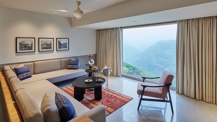 Image of a sitting area with a large window overlooking the valley at The Dukes Retreat.