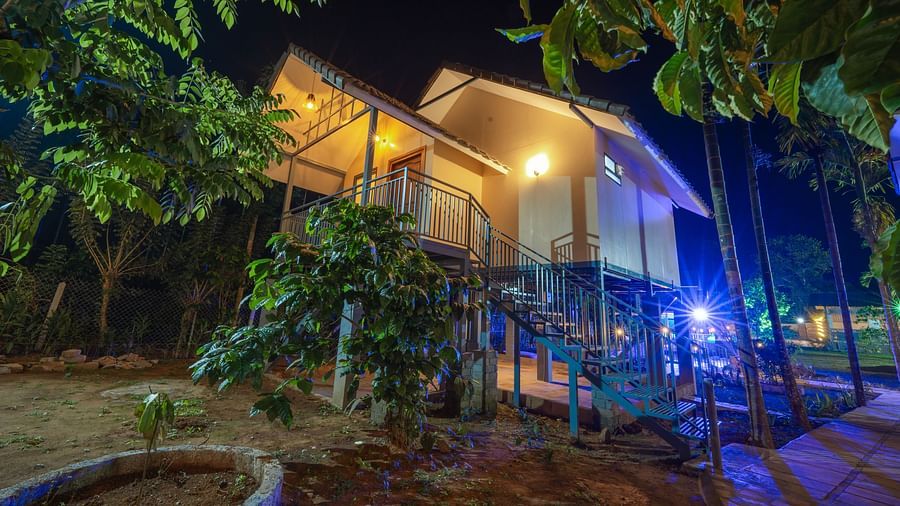 A property surrounded by tress at night at Feel Free Retreat, Wayanad