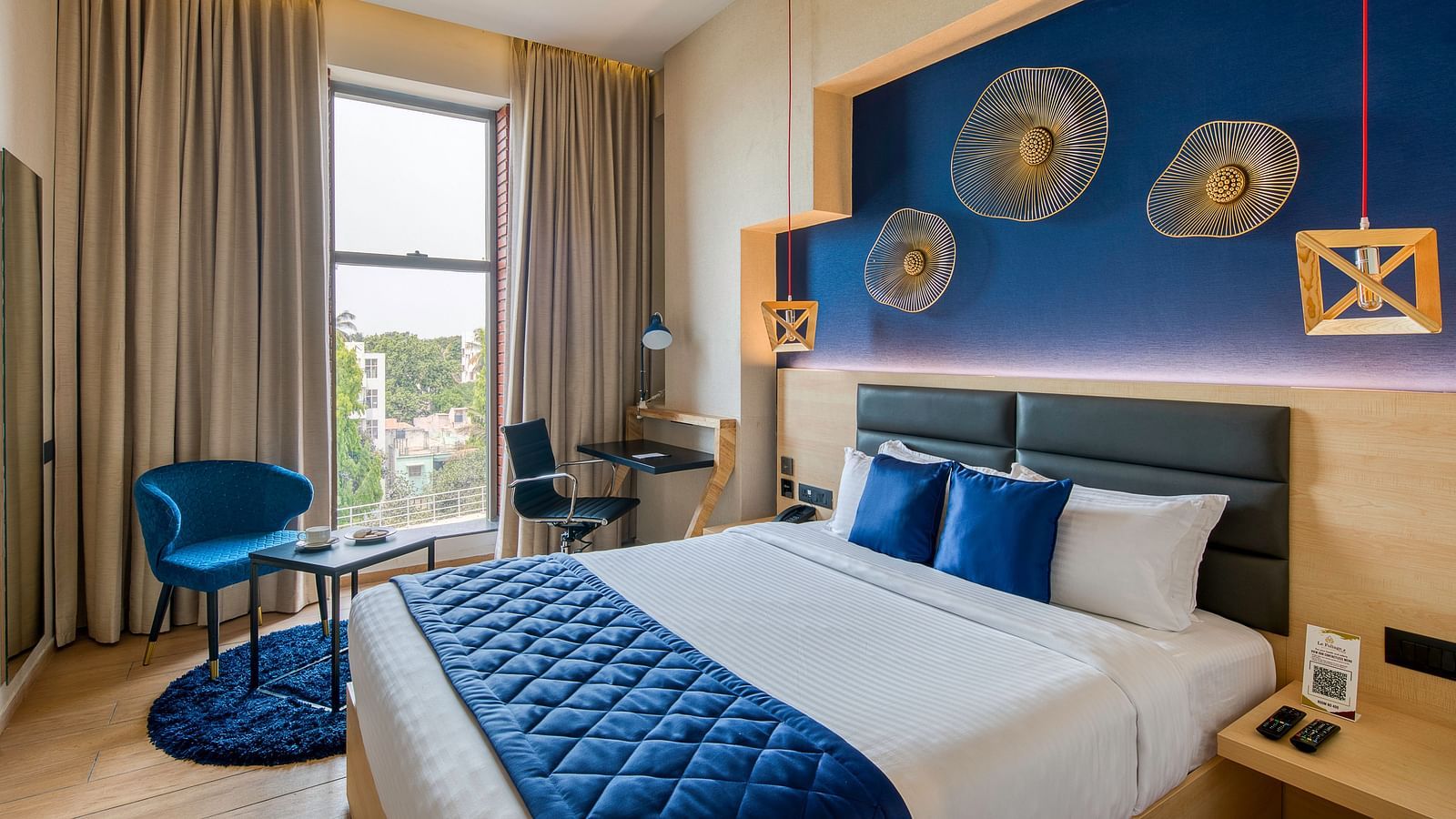 Side view of the double bed at the Premium Room at Le Foliage by TGI, Bangalore