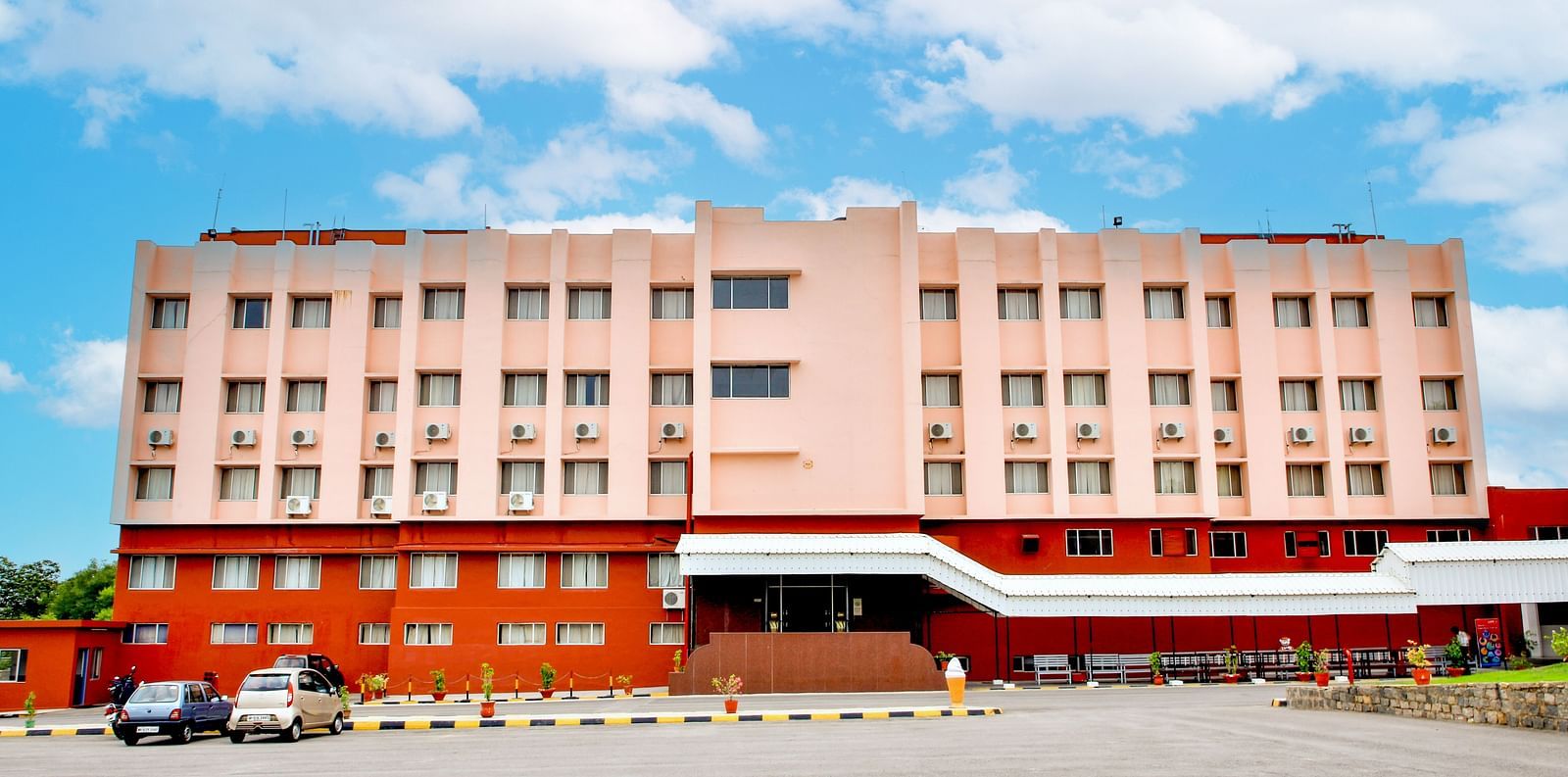 A long shot of the facade of Hotel Sahara in Ramoji Film City - Scenic Hotel Exterior in Hyderabad.