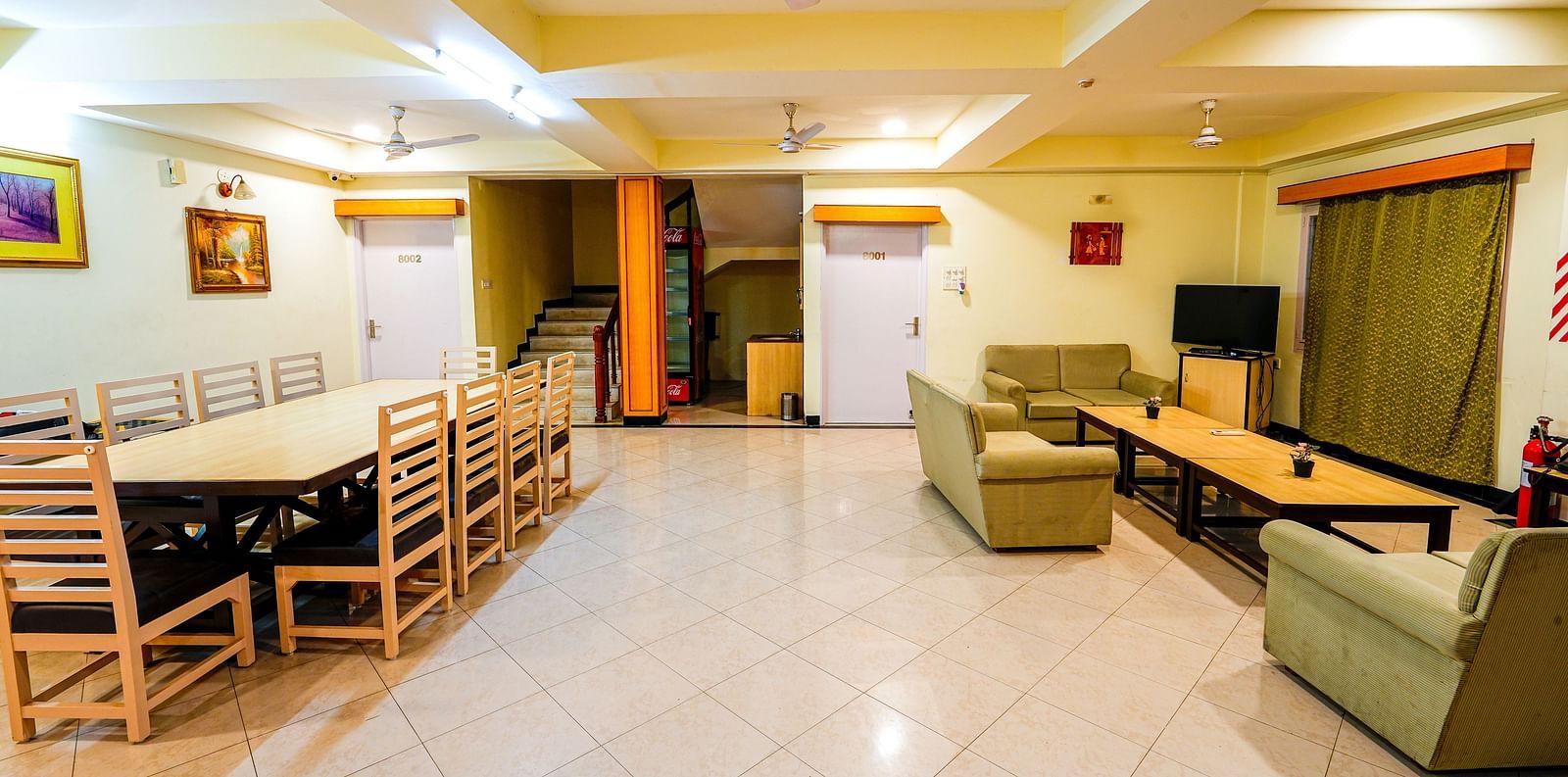 Room at Vasundhara Villa with sofa seating, a coffee table and a dining table