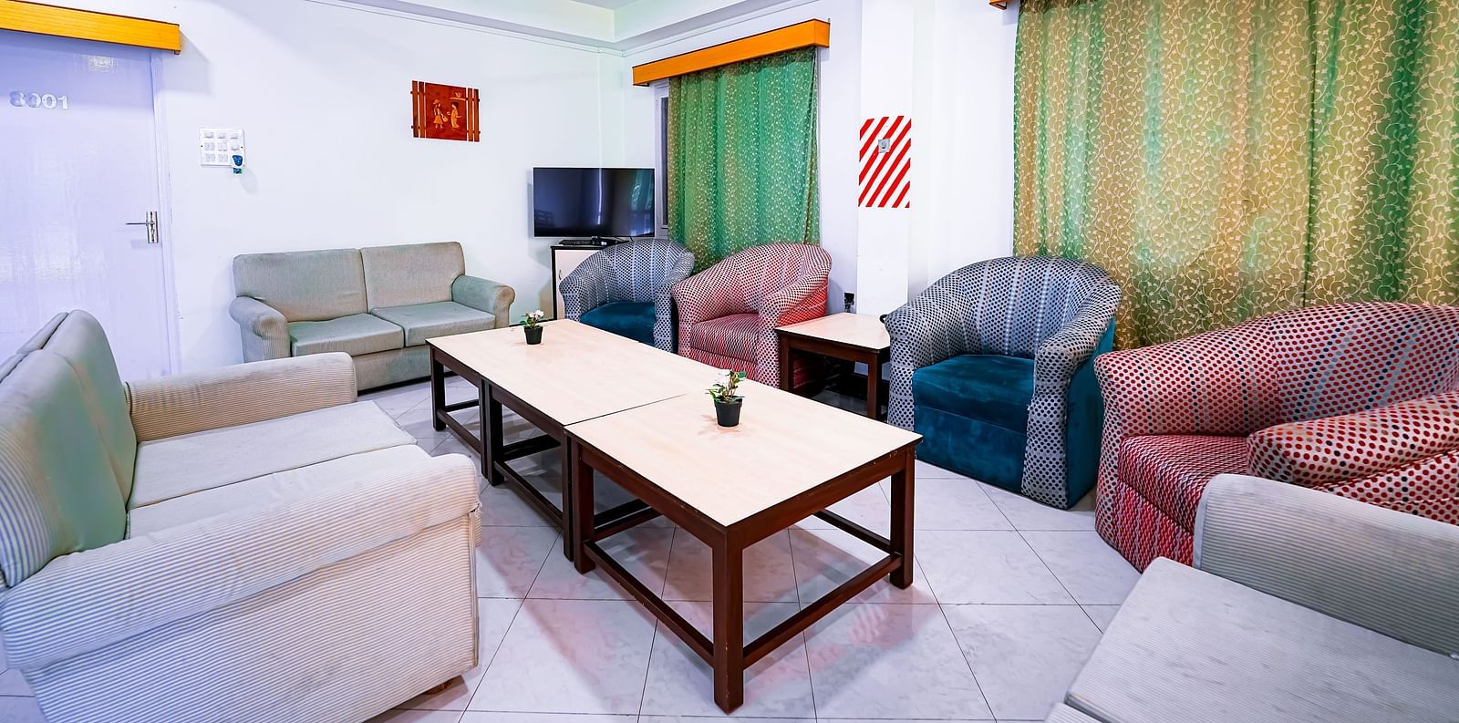 Sofa seating in the living area of Vasundhara Villa