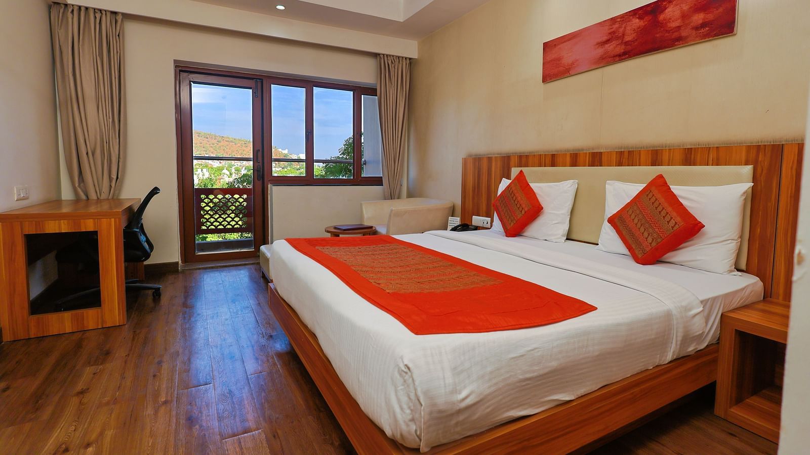 Golden Premium with Balcony and a pluhsy bed