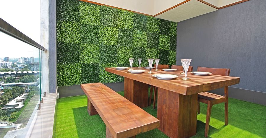 wooden dining table and chairs with picturesque views of the city