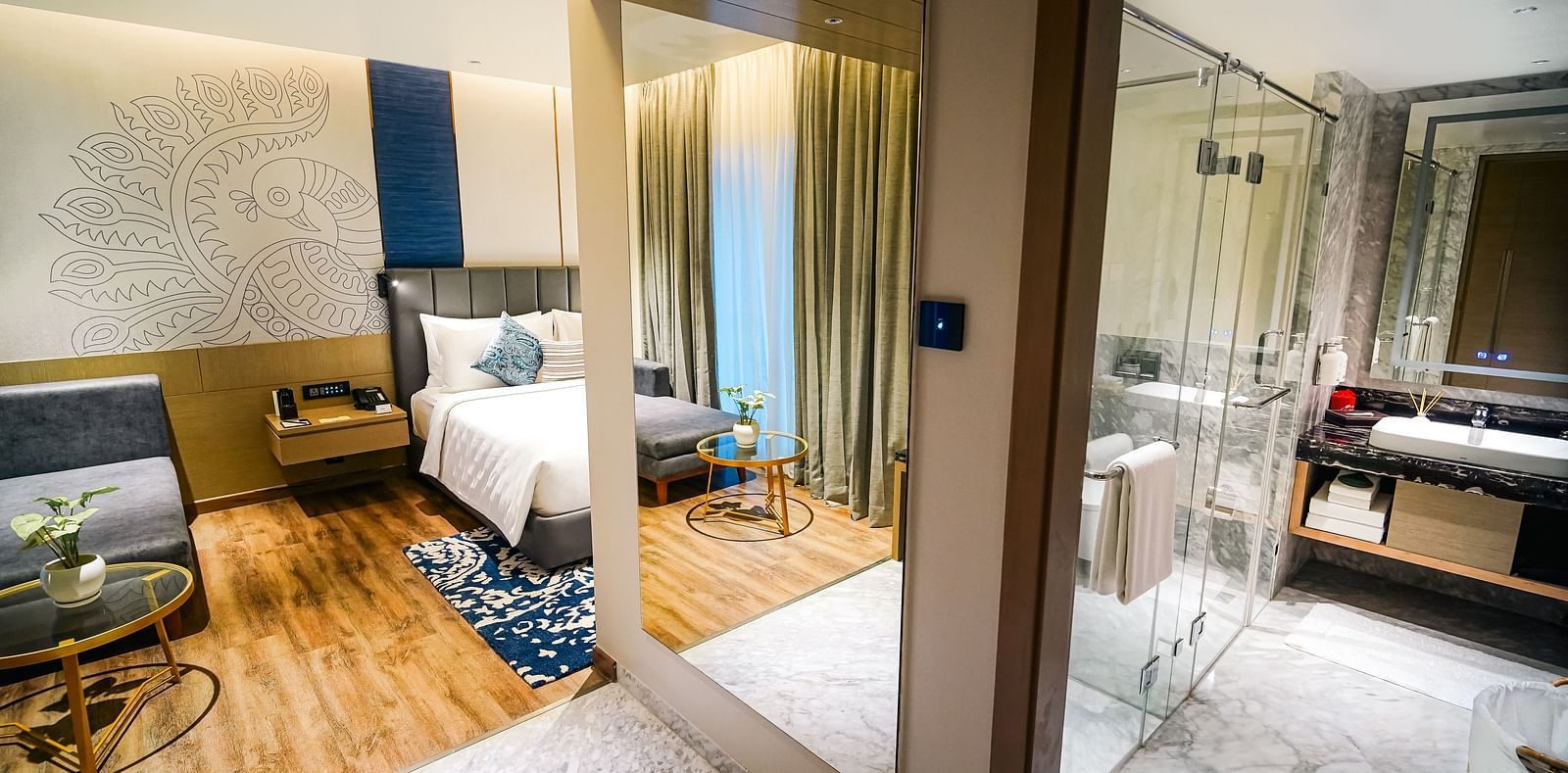 A panorama shot of the Executive Suite with a bedroom on the left and washroom on the right