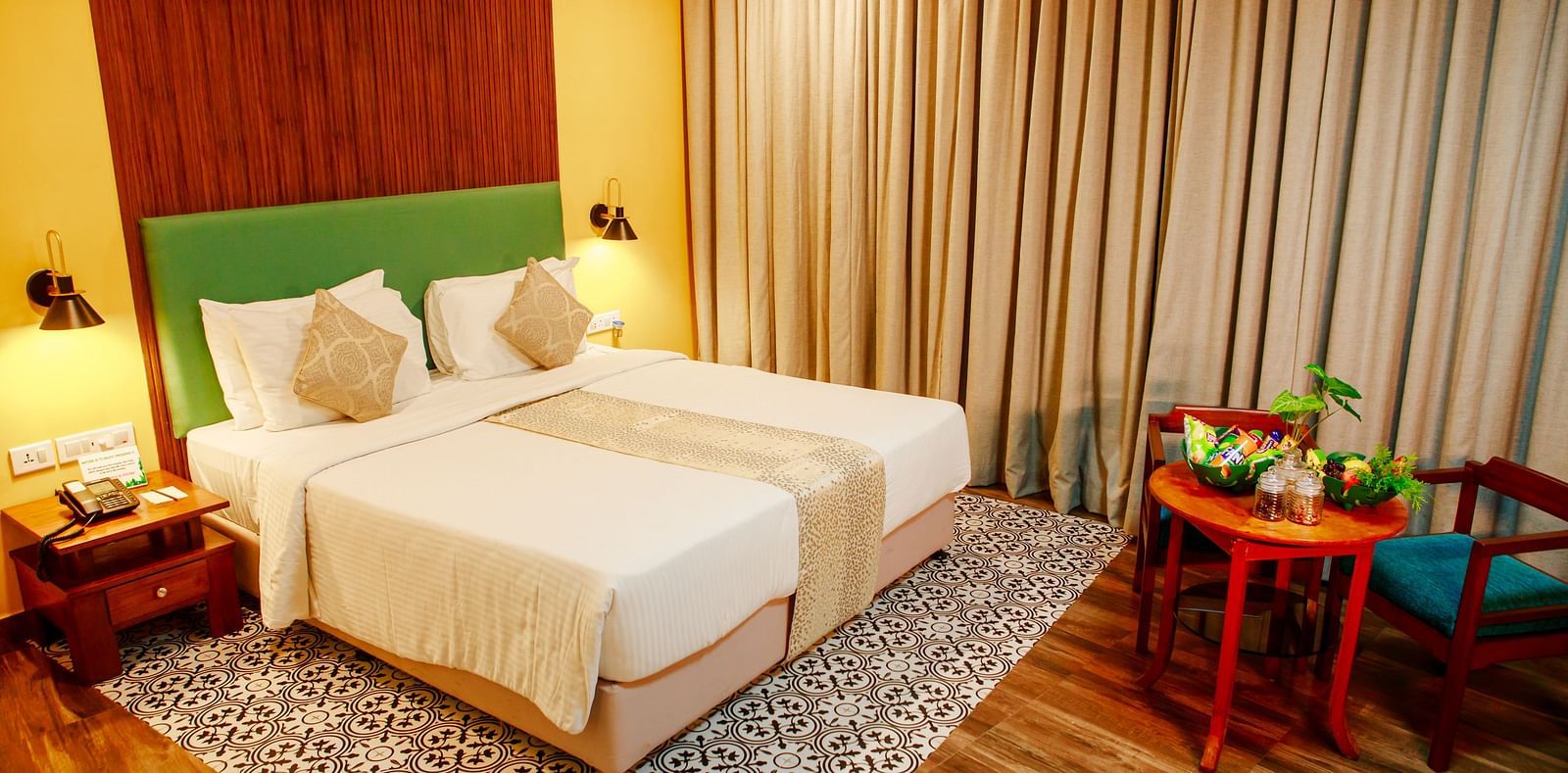 Valley View Room at GReaT Trails Yercaud By GRT Hotels - Room Stay in Yercaud that offers a double bed and a coffee table arrangement