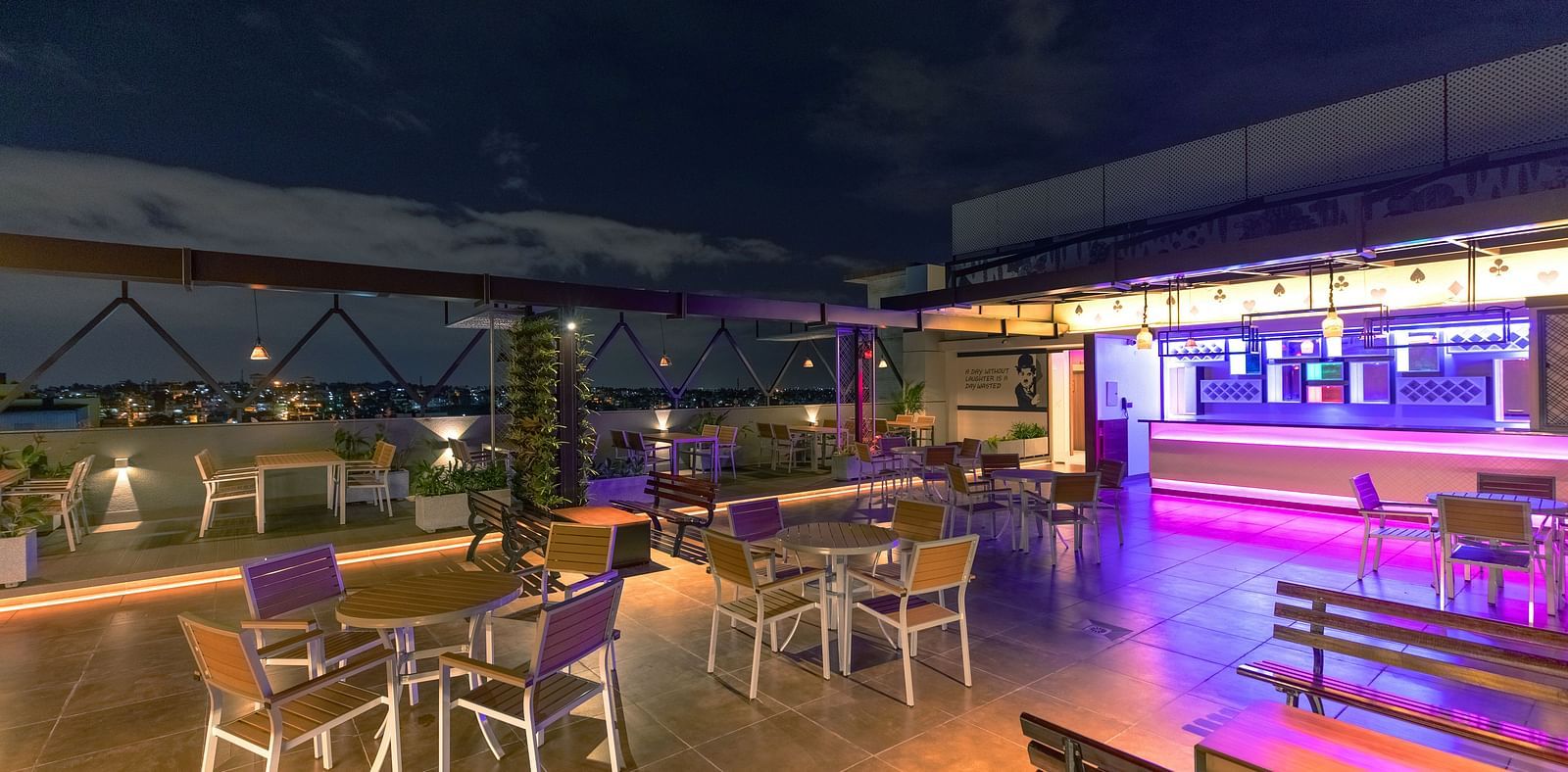 An image of a dining space with tables and chairs, complemented by an open roof at M Pro Palace.