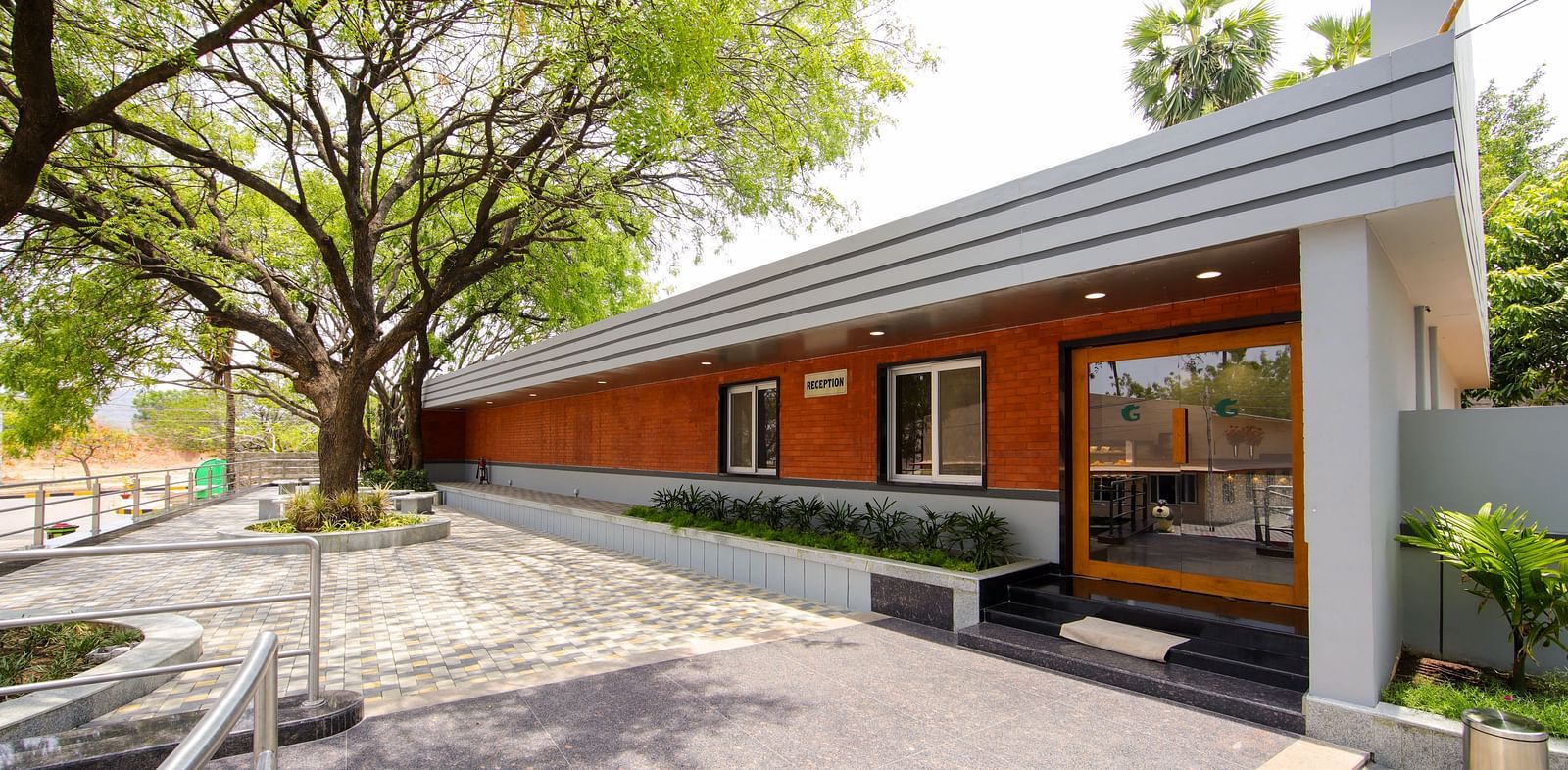 Exterior of the restaurant during daytime at Greens Inn - Daytime Dining in Hyderabad.