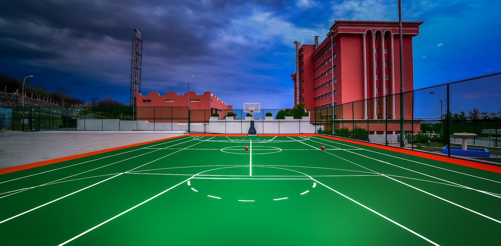 A shot the basketball court during dusk at Tara, Comfort Hotel in Hyderabad - Ramoji Film City.