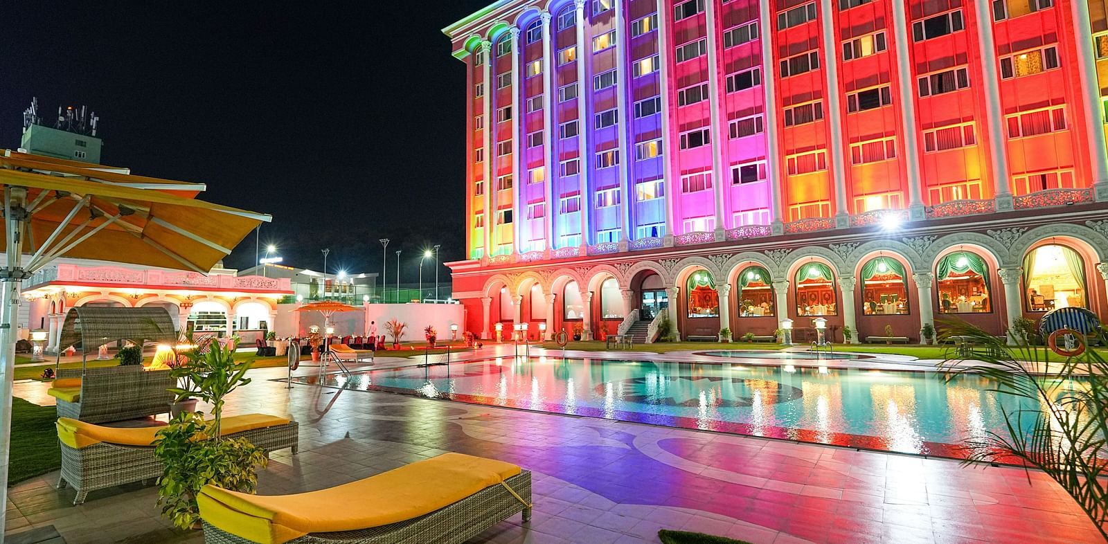 poolside view at Sitara Luxury Hotel featuring ambient lighting at night - Ramoji Film City Hotels in Hyderabad 
