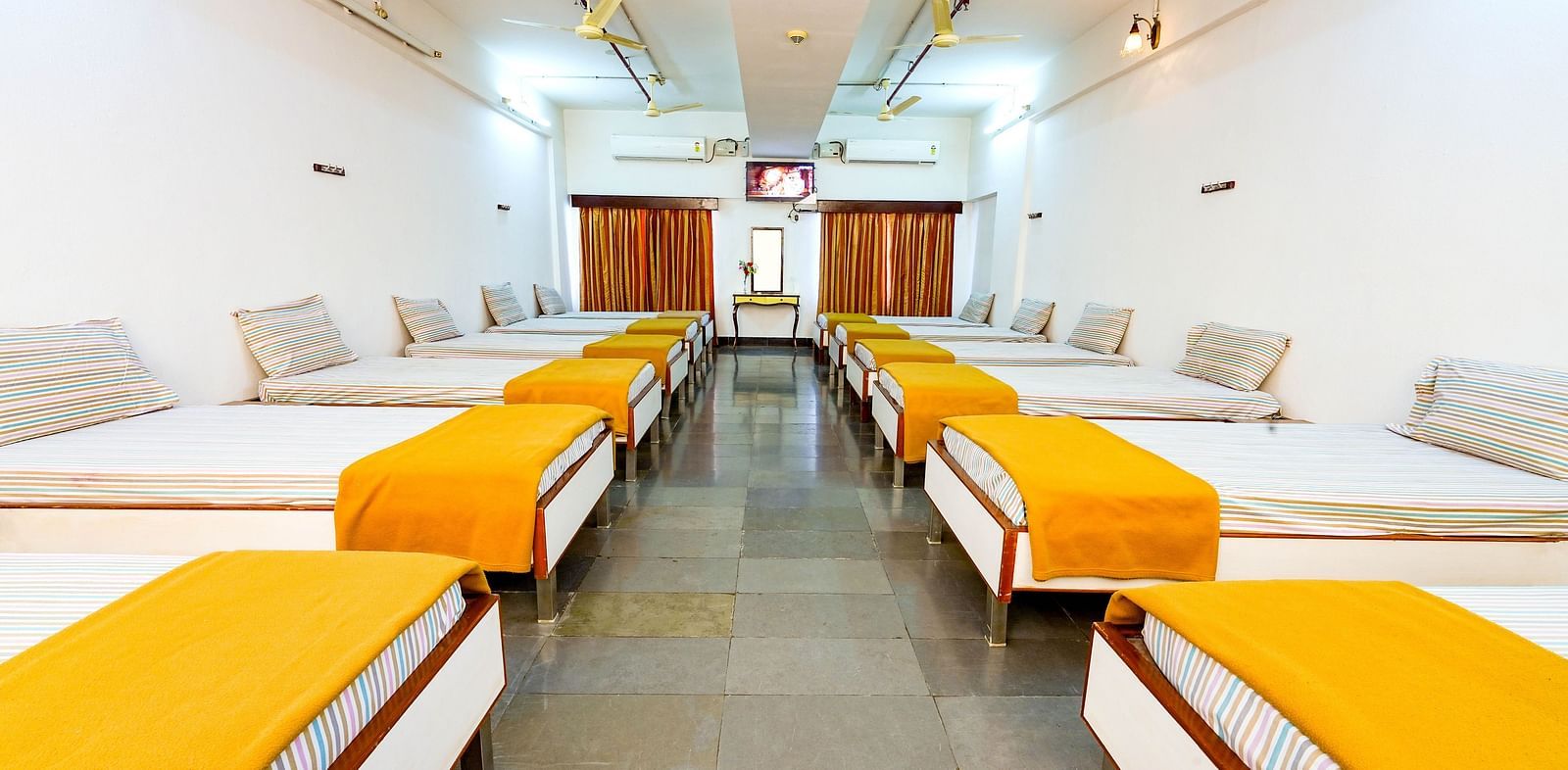 An upgraded dormitory with single beds at Sahara - Comfortable Dormitories in Hyderabad.