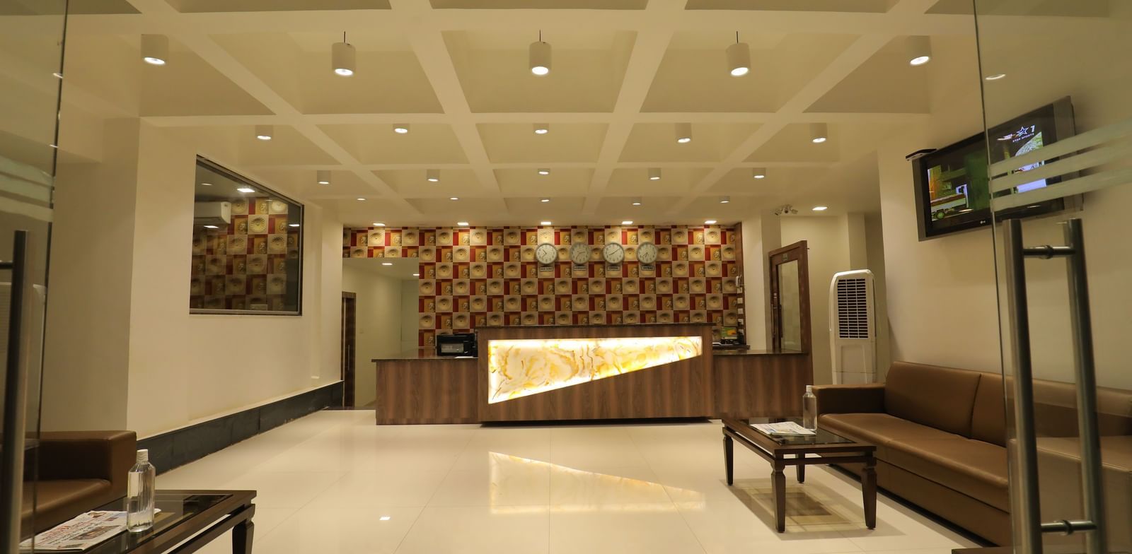 The grand lobby area of Highland Resort featuring a reception desk, and ample lighting.