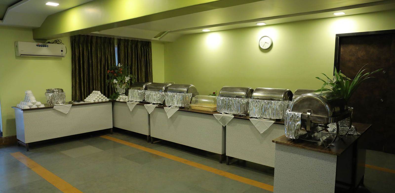 Buffet section at Krushnai Resort with multiple chafing dishes and a countertop.