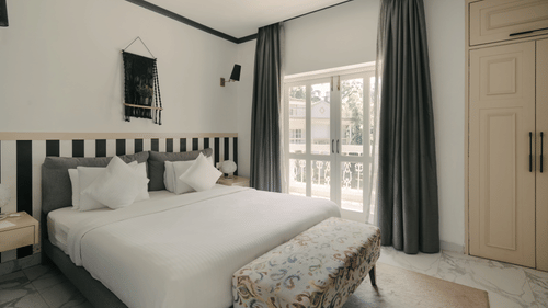 Spacious and elegantly designed bedroom at Richmonde Ananta Elite's Three BHK Premium Villa in Goa.