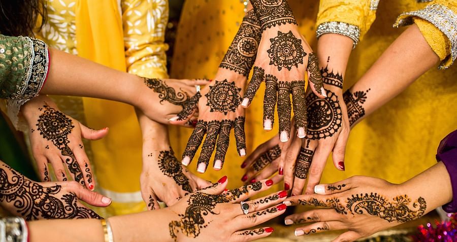 bridesmaids showing henna covered hands