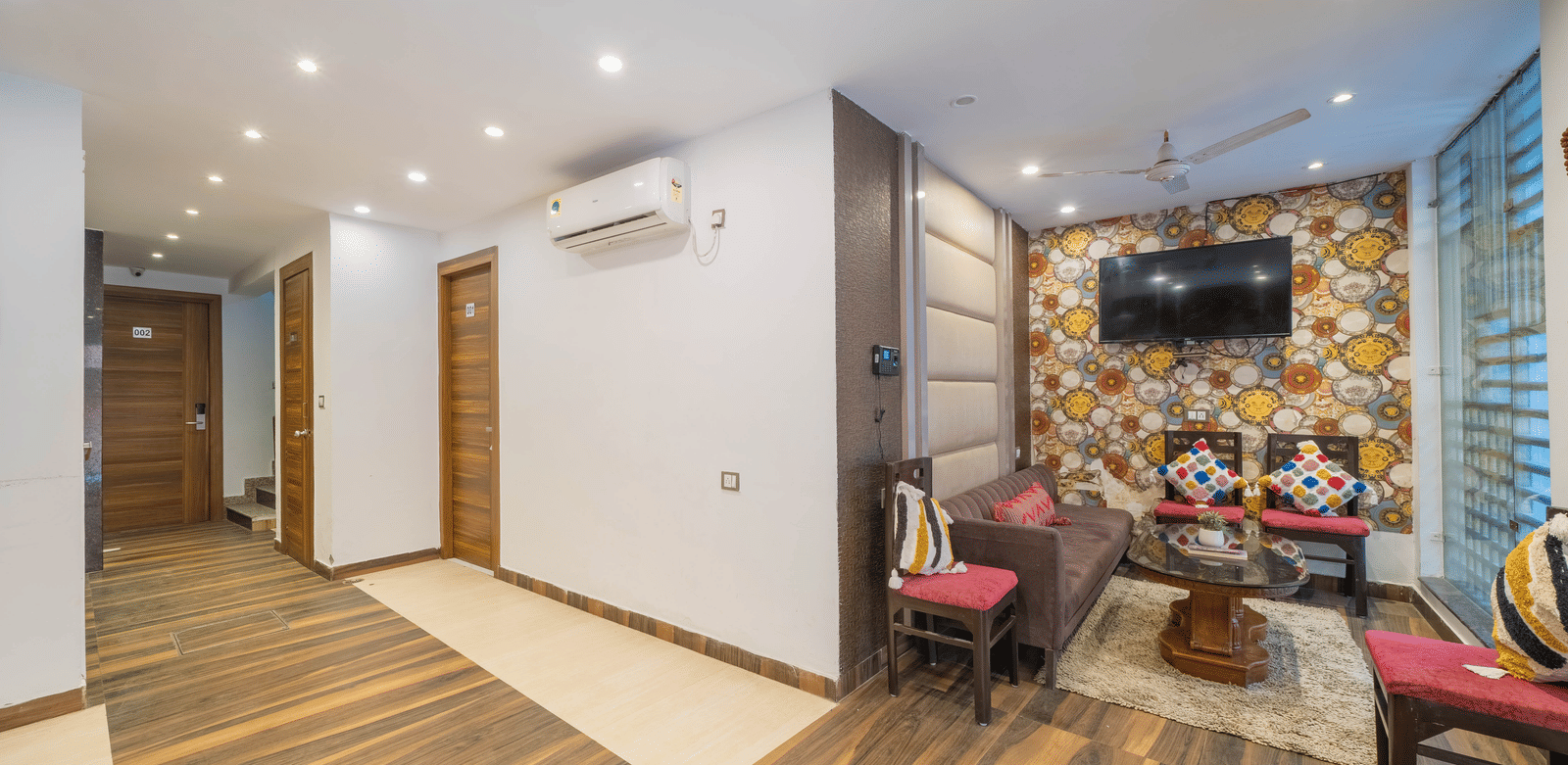 Hotel lobby or common area featuring a sitting arrangement and wooden flooring - Perfectstayz Premium at Har Ki Pauri Road (Ganga Heights)