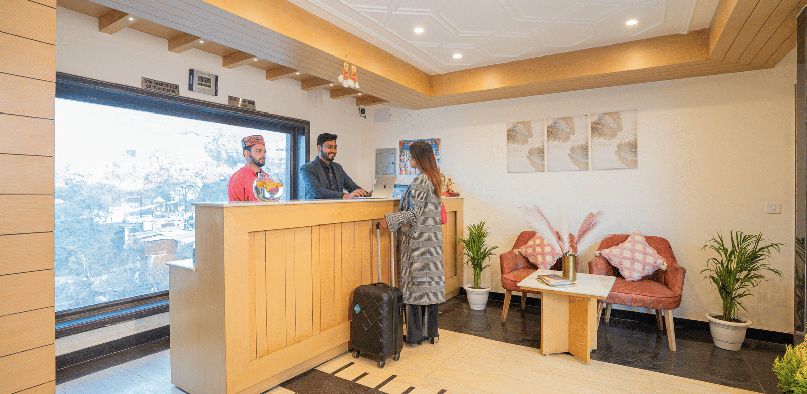 A hotel reception area with a desk and seating at Perfectstayz Premium at Mall Road Hotel Super, Mussoorie.