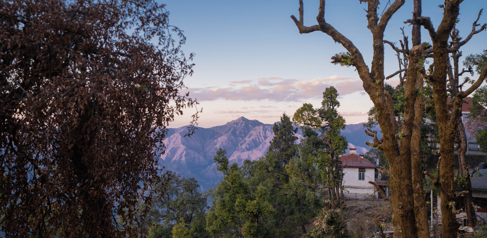 The views from the common balcony of the Super Deluxe Room With Shared Balcony & Valley View during the early evening hours showcasing the beautiful mountain vistas at Perfectstayz Premium Westend Mall Road, Mussoorie.