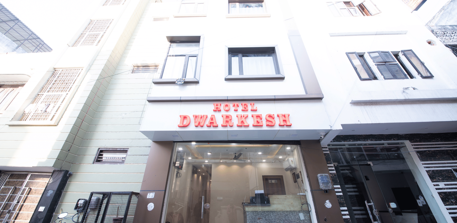 Exterior view of the hotel building entrance at Perfectstayz Value Dwarkesh, Haridwar.