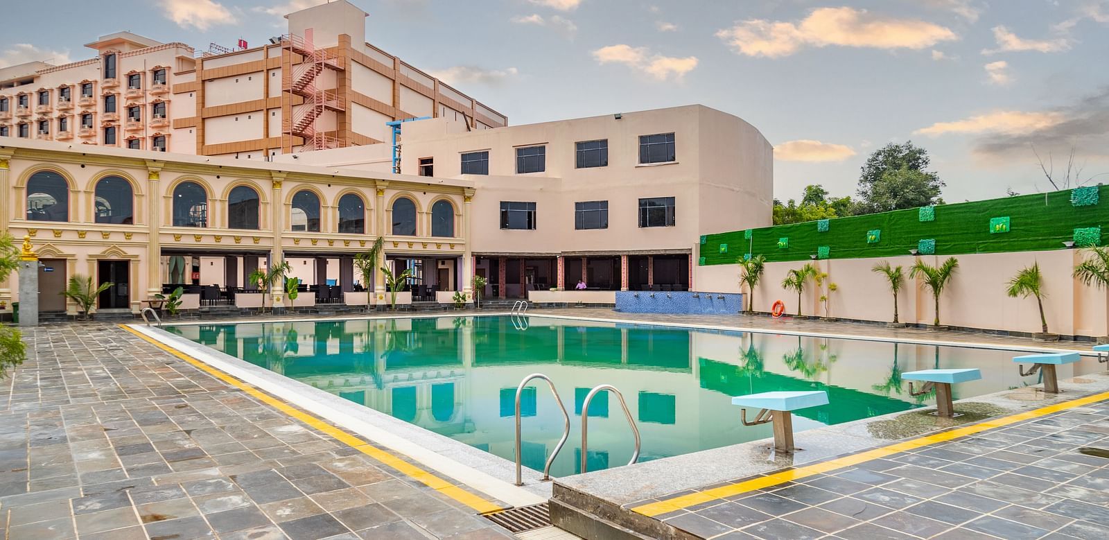 Outdoor swimming pool with a building in the background