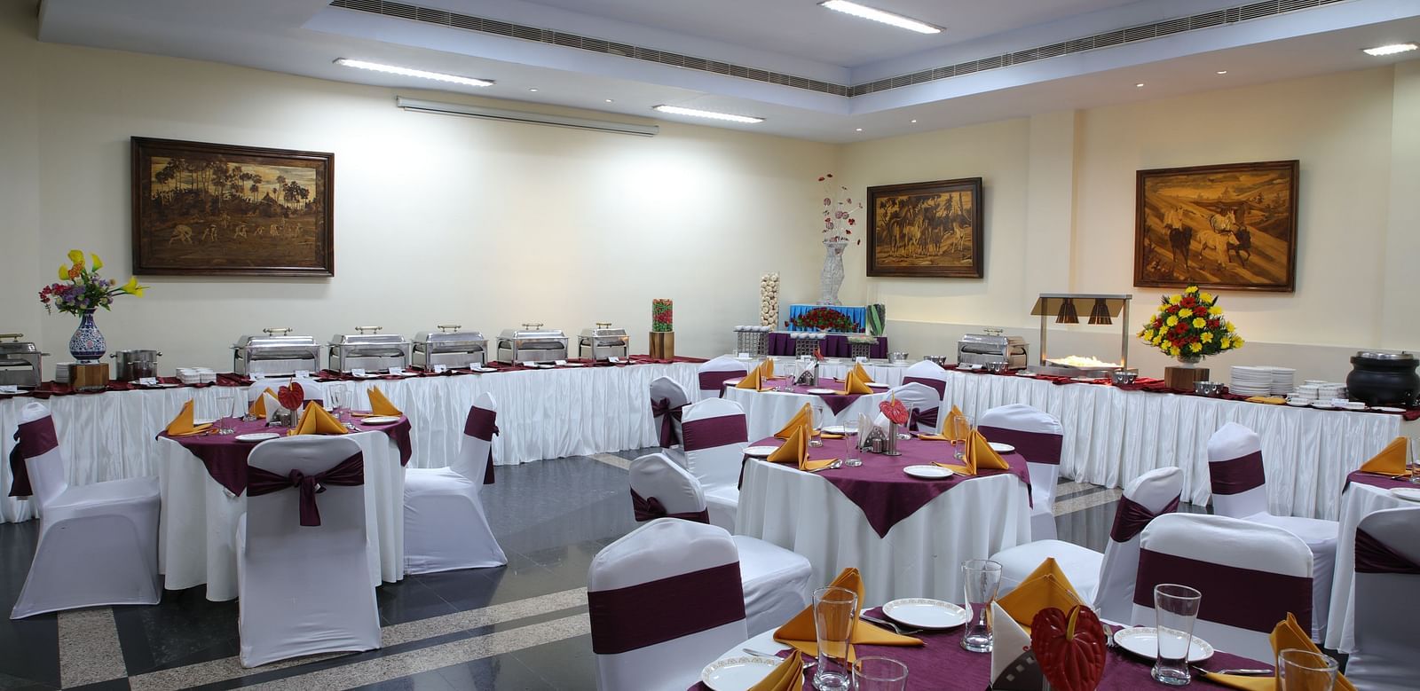 Lagan Hall decked with tables and chairs at Tara, Comfort Hotel in Hyderabad - Ramoji Film City.