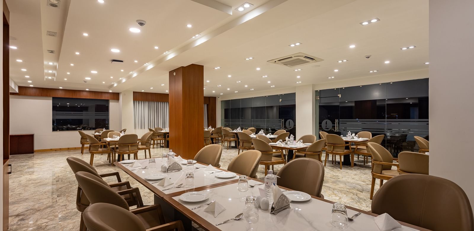 The Blue Coriander restaurant at Mandala Norling Lords Prime in Kathmandu featuring a fine dining seating arrangement and well-placed cutlery.
