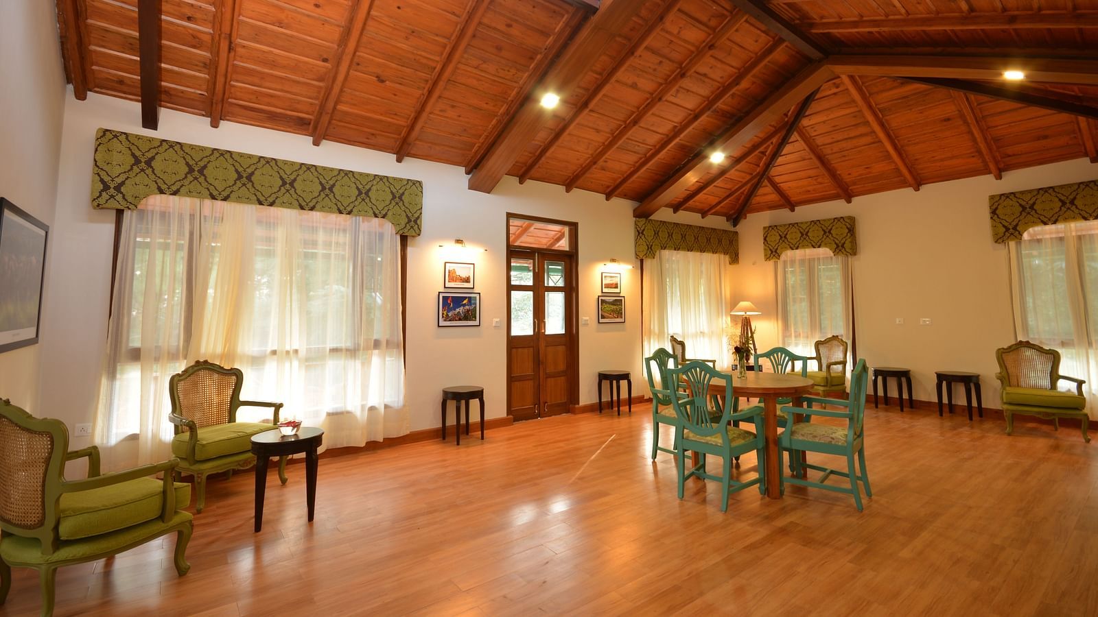 A spacious conference room in Almora with elegant wooden interiors and comfortable seating - BluSalzz Escapade - Anant Rasa Resort