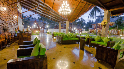 Sofas with chandelier in the centre inside the restaurant - Symphony Summer Sand Beach Resort And Spa, Neil Island
