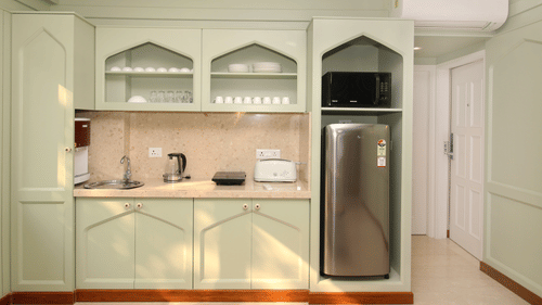 well-equipped kitchenette in rooms at theory9 bandra