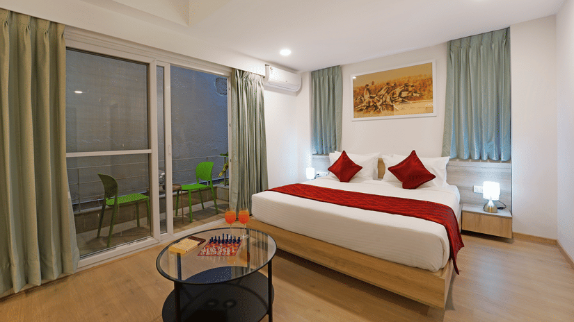 Side view of the Studio Premium Room with a cosy bed at Nest by Rivido Apart Hotel, Bannerghatta Road